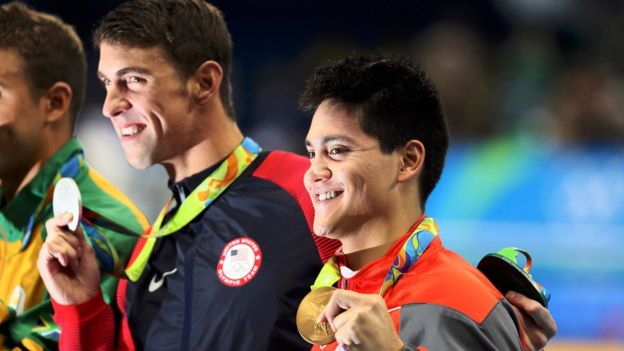 Joseph Schooling (SIN) of Singapore and Michael Phelps (USA) of USA pose with their medals.