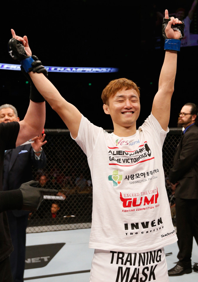 AUSTIN, TX - NOVEMBER 22: Doo Ho Choi of South Korea celebrates after his TKO victory over Juan Puig of Mexico in their featherweight bout during the UFC Fight Night event at The Frank Erwin Center on November 22, 2014 in Austin, Texas. (Photo by Josh Hedges/Zuffa LLC/Zuffa LLC via Getty Images)